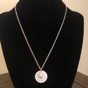 silver tone necklace with clear and pink rhinestone pendant
